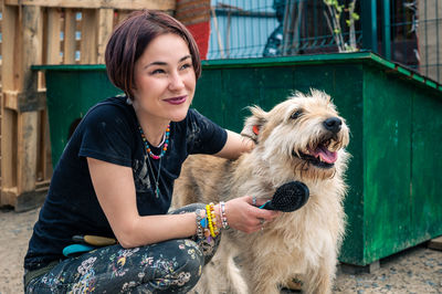 Dog at the shelter. animal shelter volunteer takes care of dogs.