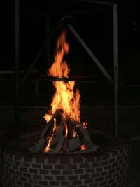 Bonfire on log at night