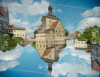 Buildings against cloudy sky