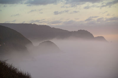 Scenic view of mountains against sky during sunset