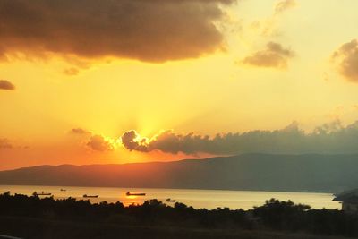 Scenic view of silhouette mountains against sky during sunset