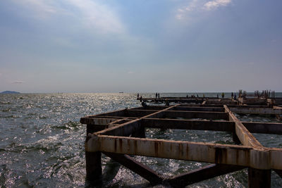 Pier over sea against sky