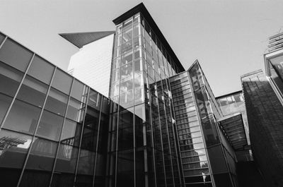 Low angle view of modern buildings against clear sky