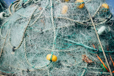 Close-up of fishing net at harbor