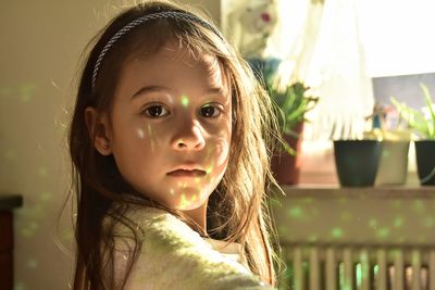 Portrait of cute girl at home