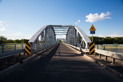 Footbridge against sky