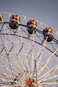 Closeup of multi-coloured giant wheel during dussehra mela in delhi, india. bottom view giant wheel