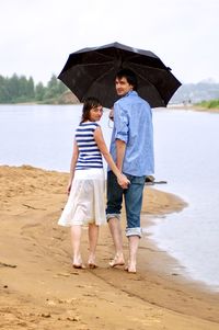 Full length of a couple on beach