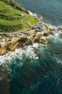 High angle view of rocks on sea