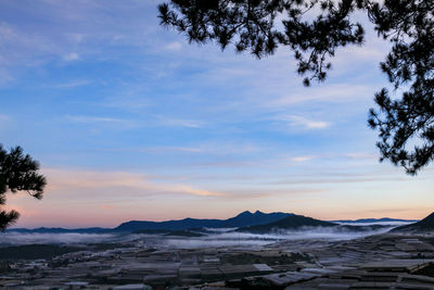 Scenic view of mountains against sky during sunset