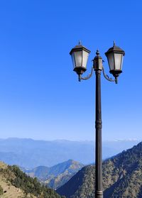 Low angle view of street light against sky