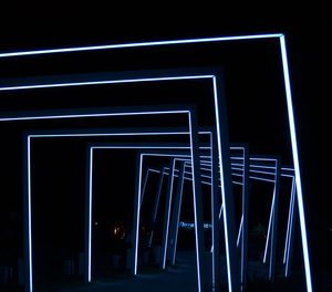 Low angle view of illuminated building at night