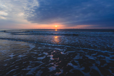 Looking out to sea on the skegness, uk beach viewing the morning sunrise.