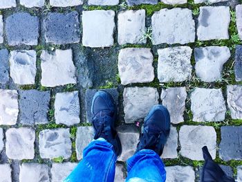 Woman standing on footpath