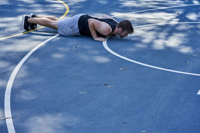 Midsection of man with arms outstretched