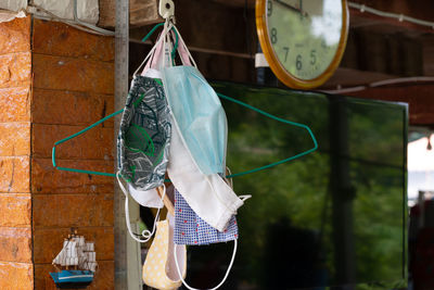 Clothes drying on clothesline against wall