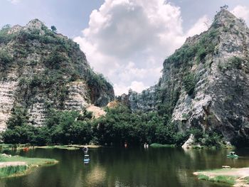 Scenic view of lake by trees against sky