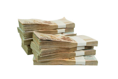 Stack of books against white background