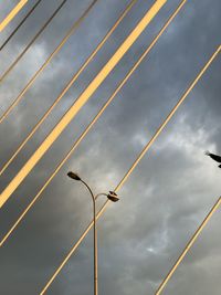 Low angle view of street light against sky