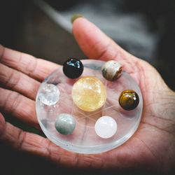 Close-up of hand holding gemstones