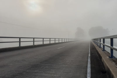 Bridge over road against sky