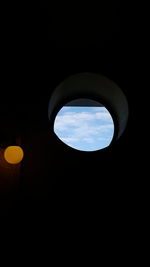 Low angle view of silhouette moon against sky at night