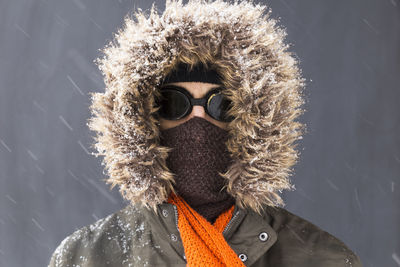 Portrait of man with ice cream in winter