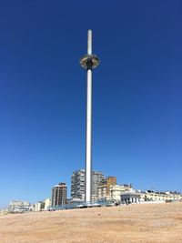 Low angle view of buildings against blue sky