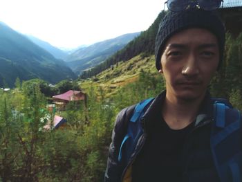 Portrait of man standing on mountain