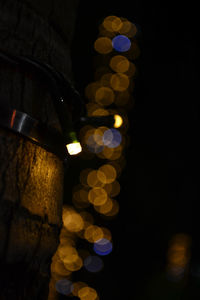 Low angle view of illuminated lighting equipment