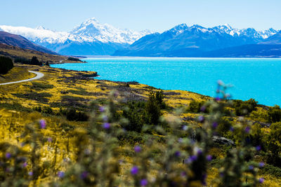 Scenic view of lake and mountains against sky