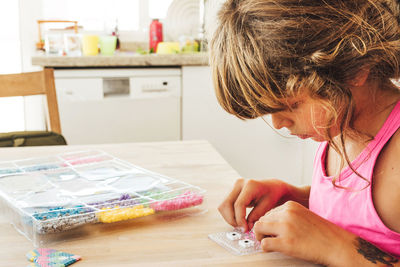 Girl playing with toys at home