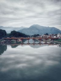 Scenic view of bridge over river against sky