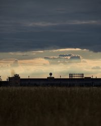 Scenic view of field against sky during sunset