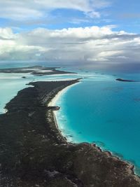 View of beach against cloudy sky