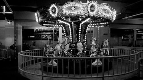 Illuminated carousel in amusement park