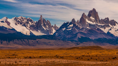 Scenic view of snowcapped mountains against sky