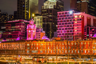Illuminated buildings in city at night