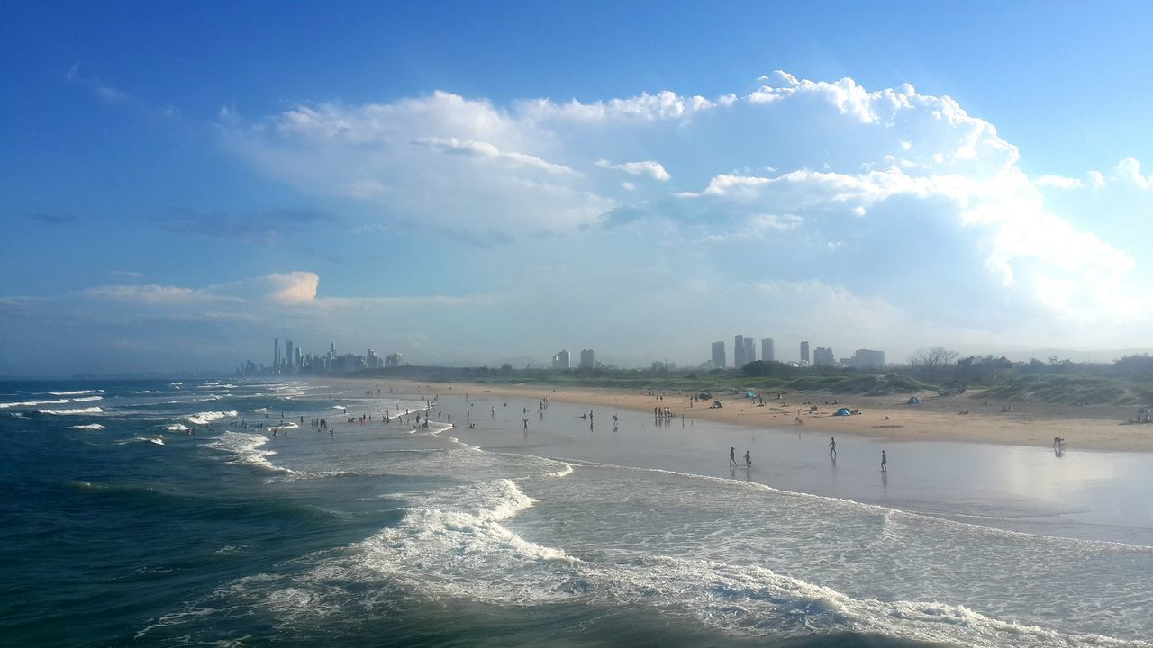 water, sea, sky, architecture, cloud - sky, built structure, building exterior, waterfront, city, horizon over water, scenics, beach, wave, nautical vessel, nature, travel destinations, travel, cloud, cityscape, tourism