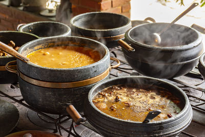 View of typical brazilian food in clay pots