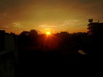 Silhouette of buildings at sunset