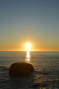 Scenic view of sea at sunset