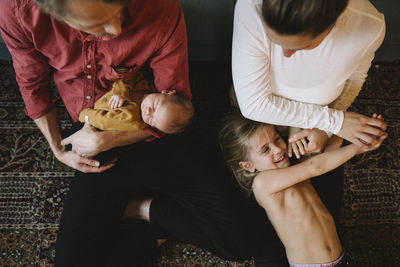 Parents with two children in living room