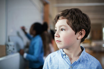 Close-up portrait of boy looking away