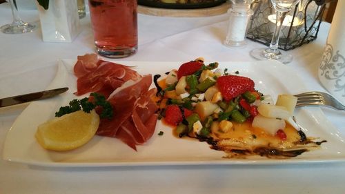 High angle view of fruits in plate on table