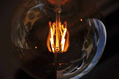 Close-up of illuminated light bulb