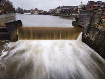 View of dam against river