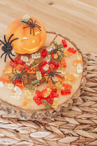Autumn still life halloween pumpkin, sweets and spiders