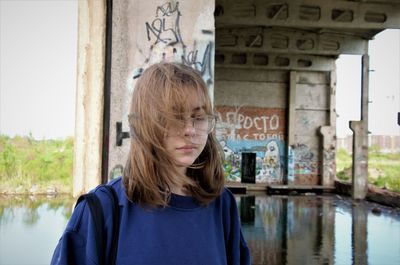 Portrait of a girl in an abandoned building. the brooding teenager