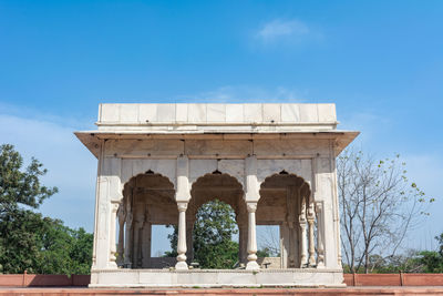 Low angle view of historical building against clear blue sky